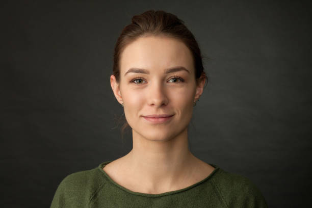 studio portrait of 20 year old woman stock photo