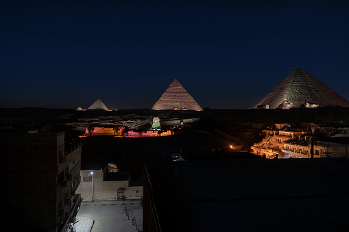 Night Sifenks and pyramids in Giza, Cairo.