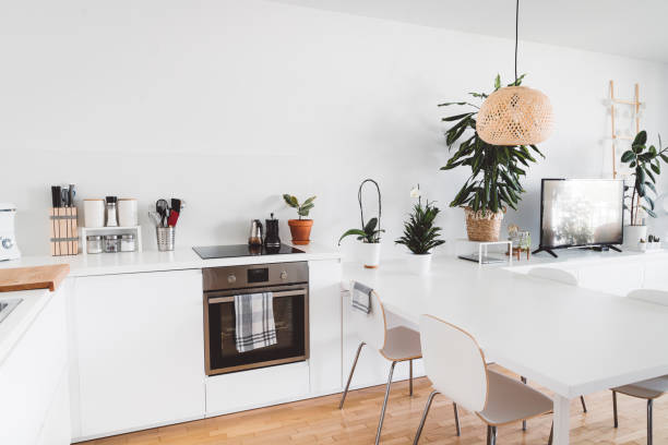 istock Built in dining room table in all white contemporary kitchen 1278156998