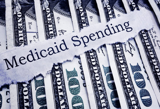 istock Medicaid Spending newspaper headline and cash 1278162444