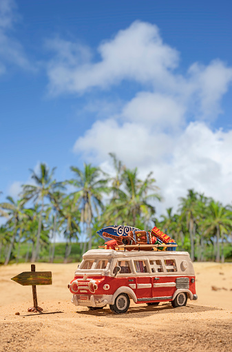 Fictional Vintage motor home at tropical beach scenery with luggage - Miniature