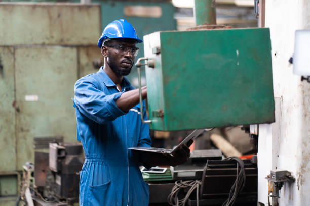 istock Male Engineer Working on digital tablet in Factory. black male engineer checking Quality control the condition of the machine 1278175089