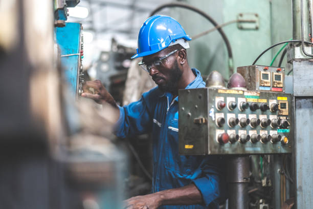 istock Male Engineer Working on digital tablet in Factory. black male engineer checking Quality control the condition of the machine 1278175105
