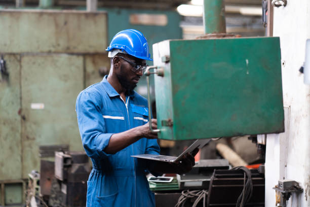 istock Male Engineer Working on digital tablet in Factory. black male engineer checking Quality control the condition of the machine 1278175127