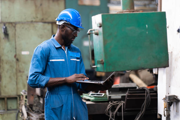 istock Male Engineer Working on digital tablet in Factory. black male engineer checking Quality control the condition of the machine 1278175150