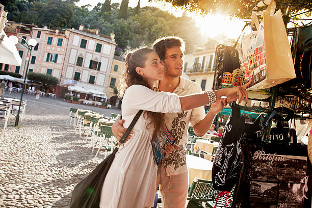 young couple on vacation in portofino - souvenir de vacances photos et images de collection