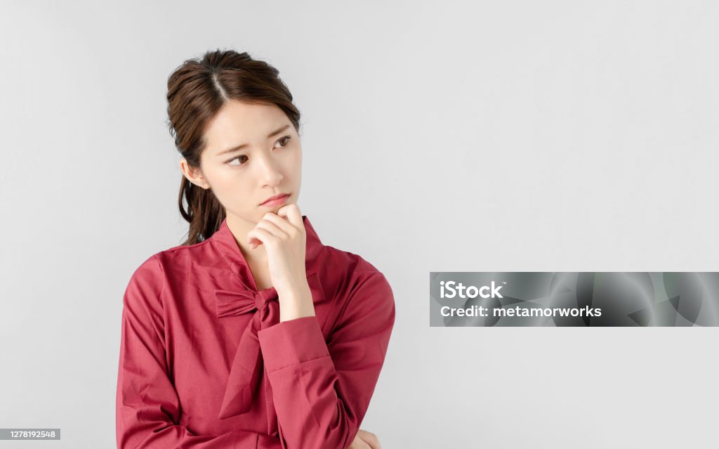 Thinking asian woman. Women Stock Photo