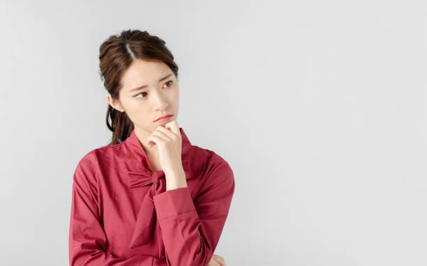 Thinking asian woman. Thinking asian woman. japanese woman stock pictures, royalty-free photos & images
