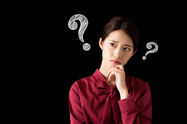 Thinking asian woman.