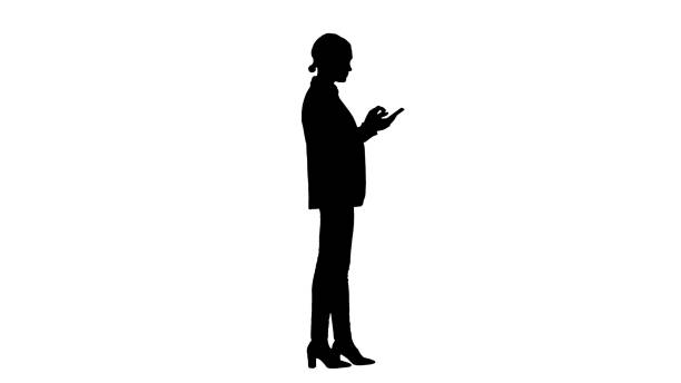 istock Silhouette Casual female in a suit texting on her phone 1278198739