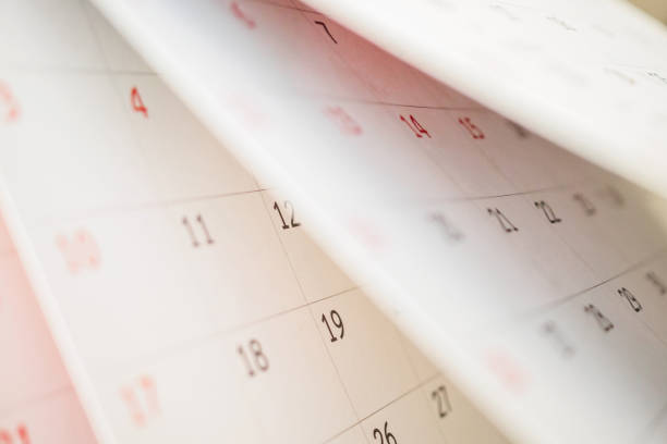 istock Calendar page flipping sheet close up on office table background business schedule planning appointment meeting concept 1278204113