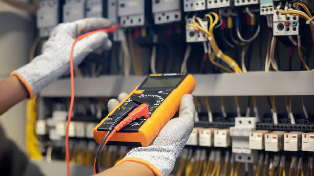 istock Electrician engineer uses a multimeter to test the electrical installation and power line current in an electrical system control cabinet. 1278207209