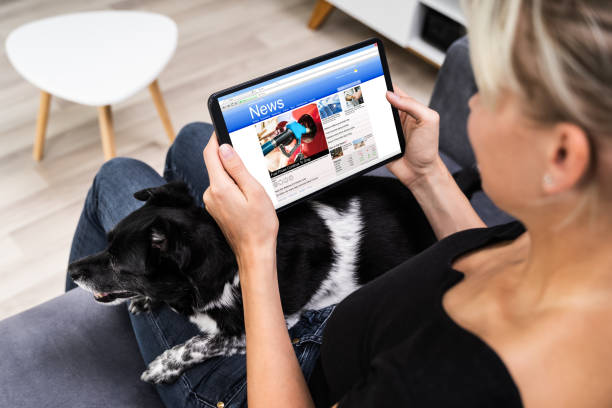 istock Reading Online Newspaper On Tablet. Watching News 1278209166