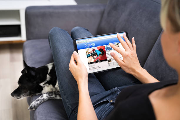 istock Reading Online Newspaper On Tablet. Watching News 1278209267