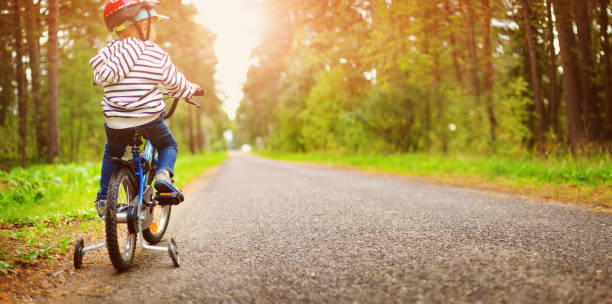 istock Child on a bicycle in helmet 1278211218