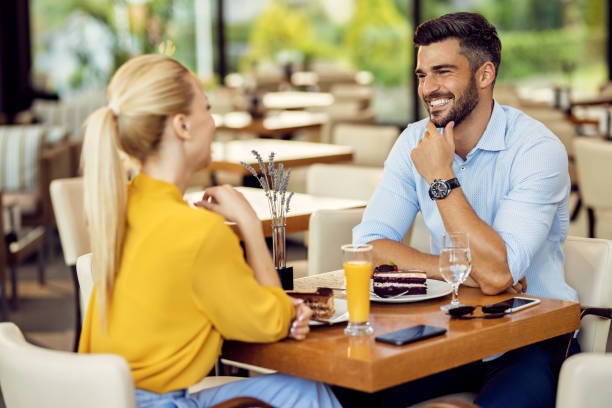 istock Happy couple talking while having dessert in a cafe. 1278211286