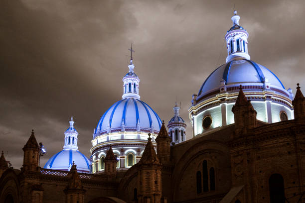 Famous domes of the New Cathedral in Cuenca, Ecuador rise over the city skyline at dusk Famous domes of the New Cathedral in Cuenca, Ecuador rise over the city skyline at dusk. cuenca ecuador stock pictures, royalty-free photos & images