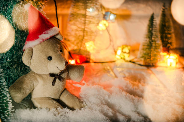 istock Lovely bear at silent night with Christmas tree and ornament, light up glitter background. Merry christmas and happy new year night. 1278213182