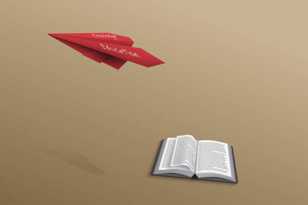 istock Thick book on navy green background was opened and its pages swayed and a red paper plane flying over the book on brown background 1278214830