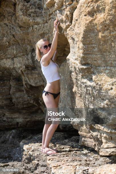 Beautiful Girl In Short Shorts Walk Near Stones Stock Photo - Download  Image Now - Adult, Adults Only, Arts Culture and Entertainment - iStock
