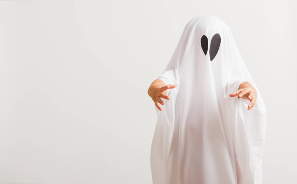 istock little cute child with white dressed costume halloween ghost scary 1278215172