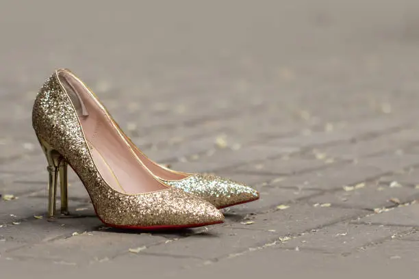 Golden glitter shoes on the street