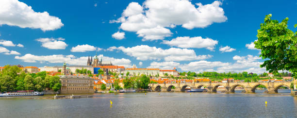 Panorama of Prague city historical centre with Prague Castle, St. Vitus Cathedral in Hradcany district, Charles Bridge Karluv Most across Vltava river. Panoramic view of Prague city, Czech Republic Panorama of Prague city historical centre with Prague Castle, St. Vitus Cathedral in Hradcany district, Charles Bridge Karluv Most across Vltava river. Panoramic view of Prague city, Czech Republic prague skyline panoramic scenics stock pictures, royalty-free photos & images