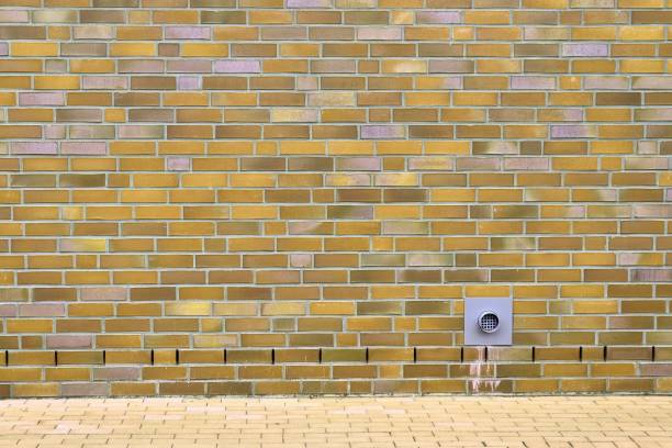 istock Detailed view at a colorful old and weathered brick wall texture as a panoramic background. 1278220980