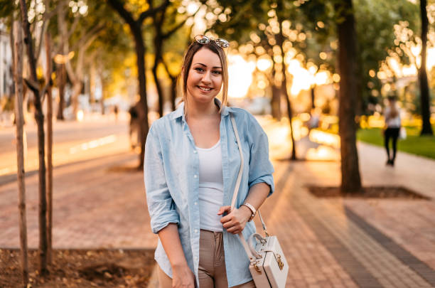 istock Smiling woman in park 1278222049
