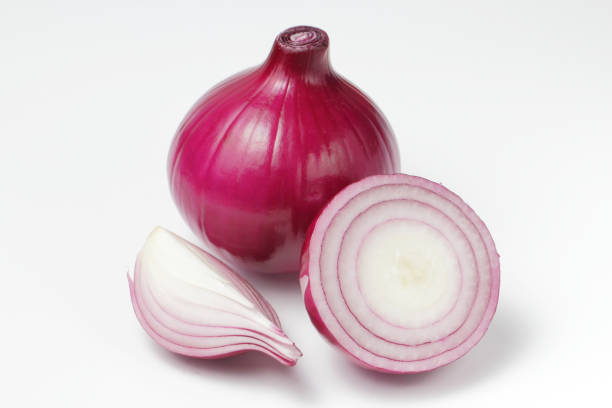 istock Red onion and chopped onion slices on a white background. 1278223963