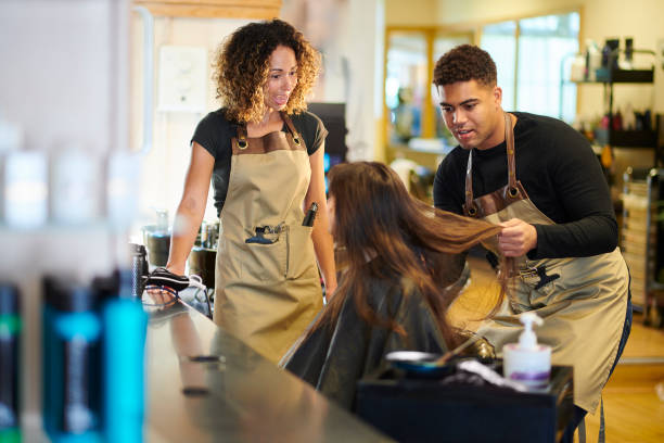 junior stylist with customer and mentor
