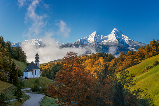 Church and Montains in Gruyeres, Switzerland.