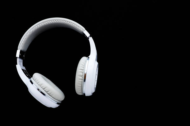 istock white wireless headphones on a black background. copy space. 1278228530