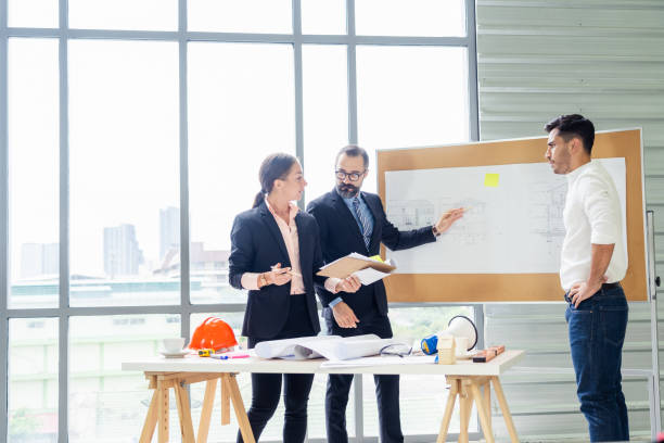 istock Group engineering or business people working and meeting with manager, Project planner or architecture discussion with team, Focused on senior man face 1278230620