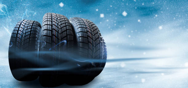 istock winter tyre cover on Lights on blue and snow background 1278232791
