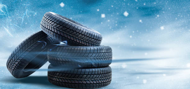 istock winter tyre cover on Lights on blue and snow background 1278232818