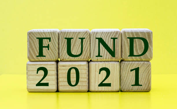 istock FUND 2021 words on wooden cubes on a yellow background 1278234263