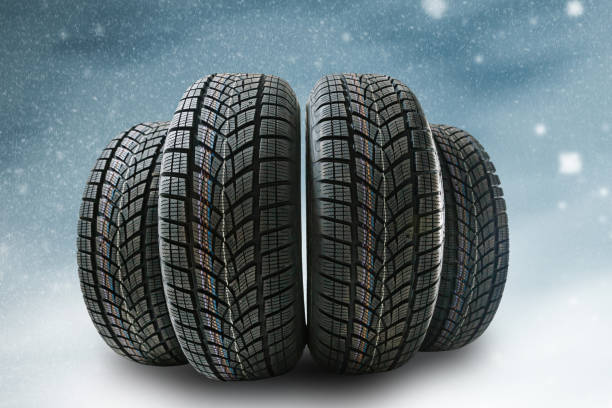istock winter tyre cover on Lights on blue and snow background 1278235340