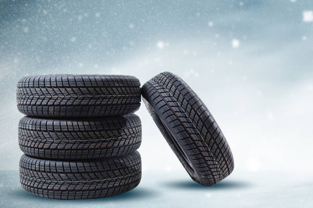 istock winter tyre cover on Lights on blue and snow background 1278235400