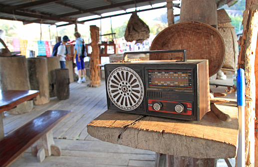 Old radio set on a wooden table in tourist attractions