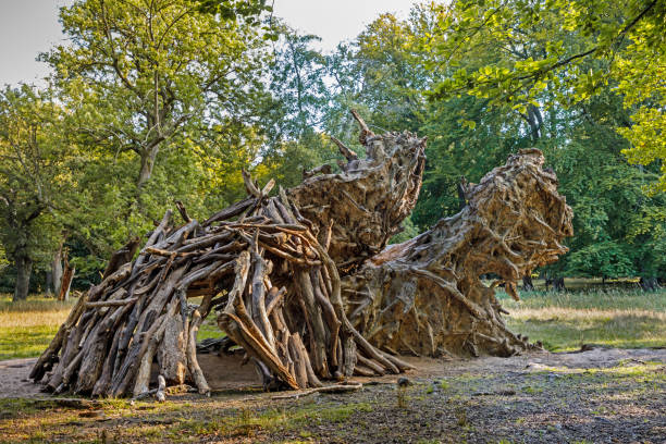 istock Children’s hut or shed build by branches under a fallen tree 1278235687
