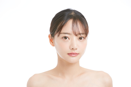 Beauty portrait of young Asian woman and white background and strobe lights.