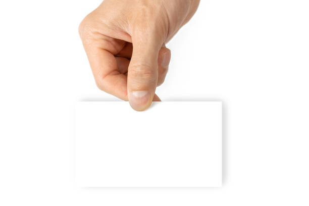 istock Blank white card. Hand holding blank business paper card isolated on white background. Empty credit template in person arm. 1278237004