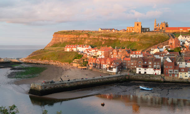istock Whitby harbour waterfront buildings at Sunset 1278237049