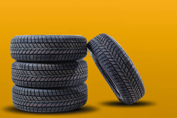 istock Car tires isolated on yellow background 1278237952