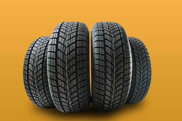 istock Car tires isolated on yellow background 1278237961