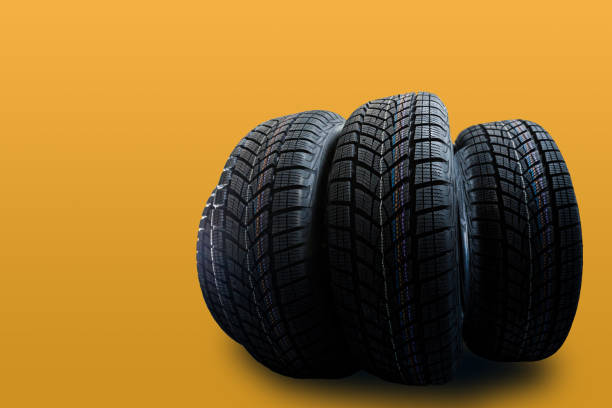 istock Car tires isolated on yellow background 1278237968