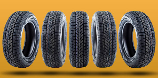 istock Car tires isolated on yellow background 1278237974