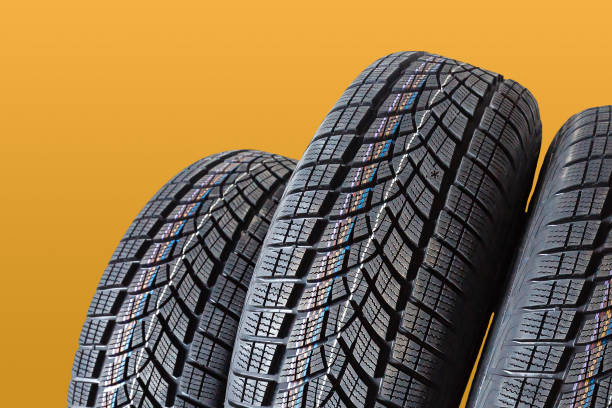 istock Car tires isolated on yellow background 1278237981