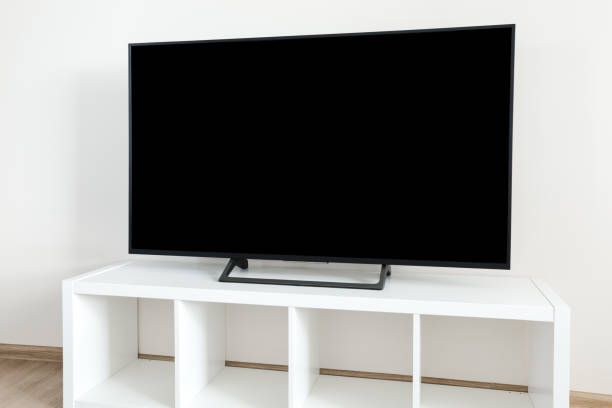 istock Lcd tv on white shef at modern room interior 1278238140